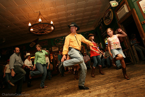 Line dancing at a cowboythemed wedding