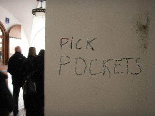 Even the graffiti in Prague warns you about pickpockets.