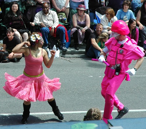 Resisting Arrest, pink argument between equal clowns; lady and police officer, The Pink Police with Resisting Arrest. Fremont Street Fair, Seattle, Washington, USA by Wonderlane