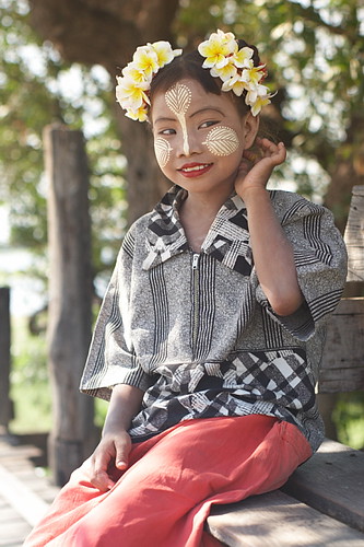 Myanmar girl with traditional make-up thanaka