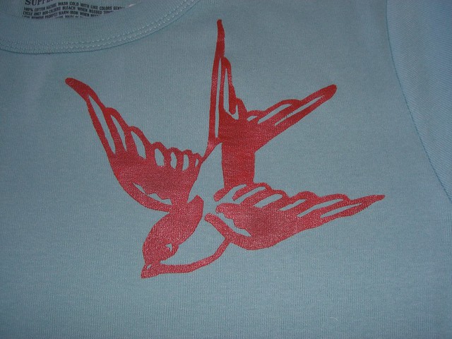 Cherry red swallow stencil on baby blue tee for Sarah OWS 19