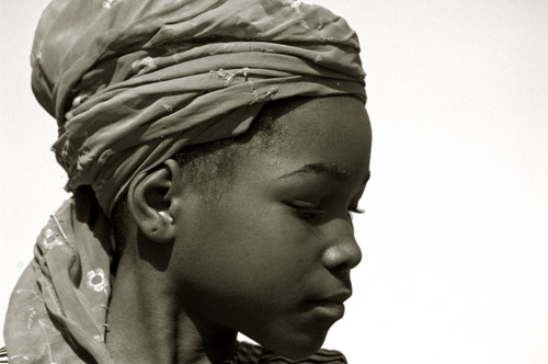 Portrait of an african girl wearing a traditionnal boubou style hat