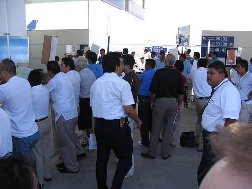 The crazy scene at the Cancun airport - drivers waiting to pick passengers up!