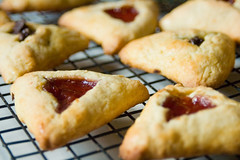 One traditional delicacy that you can almost always find in a Purim basket is the three-cornered fruit-filled pastries known as Hamentashen.