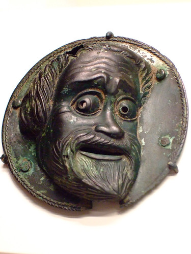 Roundel with a comic mask Greek from South Italy about 300 BCE Bronze