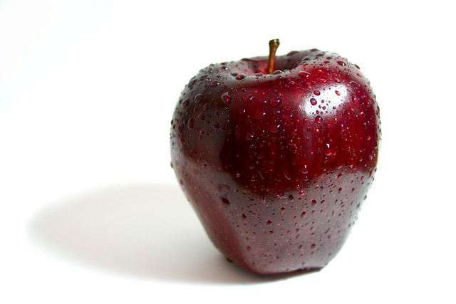 Red Apple On Whiteground With Droplets