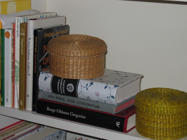 Round boxes in the book shelf