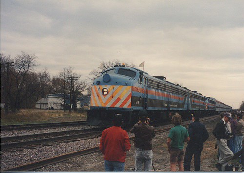Three EMD E-8 passenger locomotives performing a photo runby near Harvard Illinois. Photographed during the C&NW /Metra  EMD E-8 Last Run fantrip from Chicago to Harvard Illinois. by Eddie from Chicago