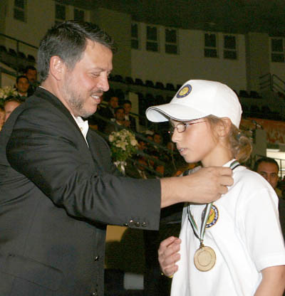 His Majesty King Abdullah presents HRH Princess Iman with a gold medal for