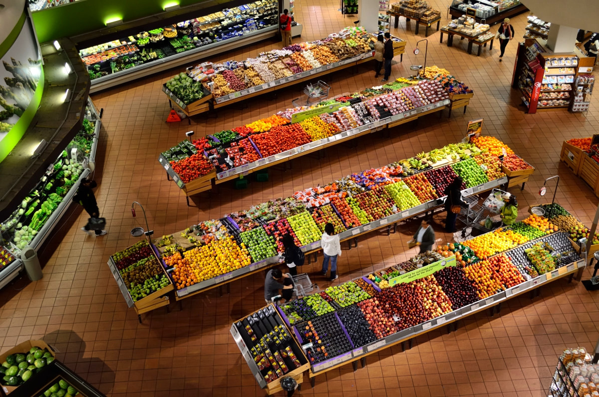 Consumers shopping for produce and fruit. in a supermarket