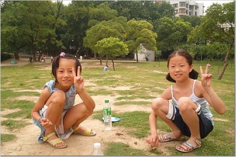 girls squatting in park