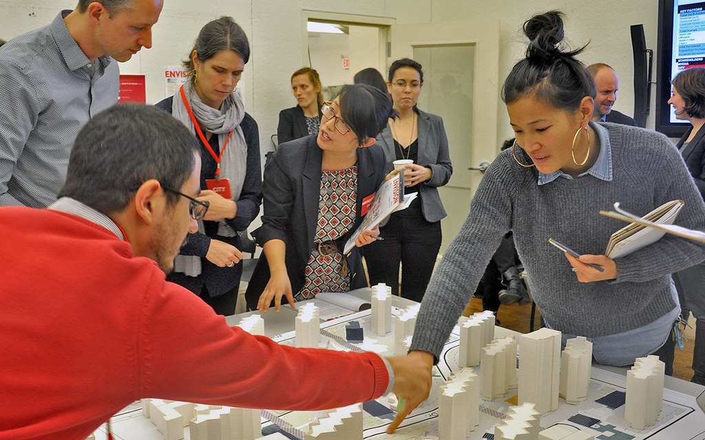 Guest jurors collaborate on development decisions for the Envision Baruch planning model. 