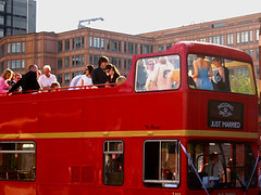 A Just Married red London bus with open top deck