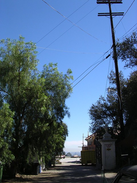 10050 Cielo Drive View of the gate from Cielo Note telephone pole on the 