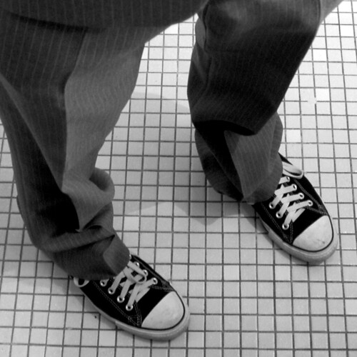 Chuck Taylors and a pinstripe suit by Punkartist