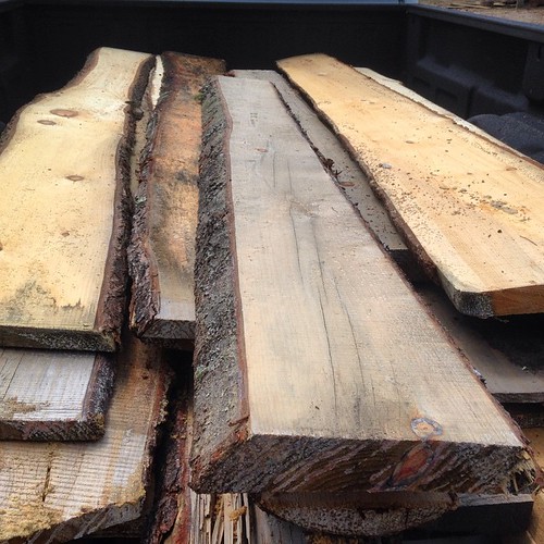 The off-cuts from sawmills are often discarded and wasted. Check to see if you can get free slab wood from your local mill. There are lots of uses.  Part of this is going towards panels for a compost bin. Could also be nice for siding an #adirondack cabin