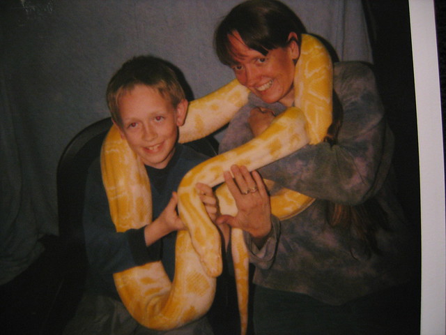 Old polaroid of me and Nolan with a giant snake draped around us