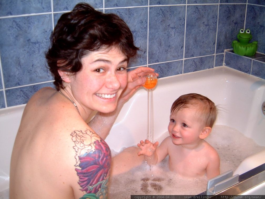 Mom bathing son
