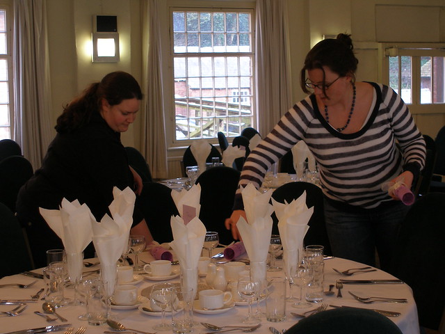 Beth and Gillian setting up the tables at the wedding reception