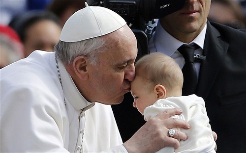 Pope Francis kisses baby