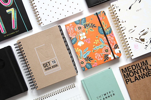 group of spiral notebook planners