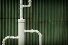 Water works pipes in front of grunge background
