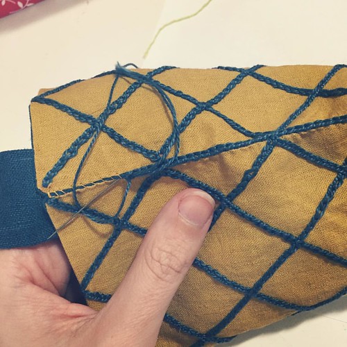 Finishing up the edges of the pouch with chain stitch.