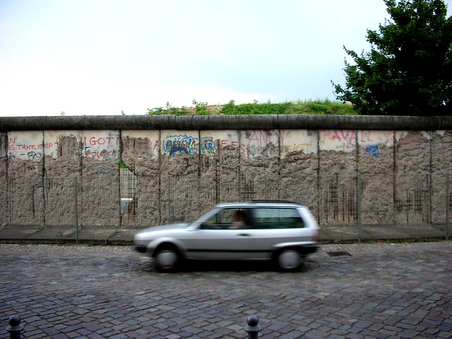 Car Passing By Section of the Berlin Wall
