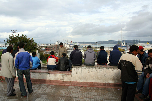 Young men in Morocco, Europe on the horizon. Photo: moritz_siebert/flickr.