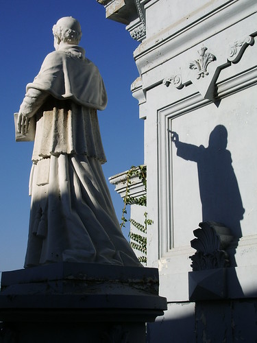 Priest statue makes a bunny shadow puppet