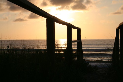 ocean beach sunrise walkway sillouite