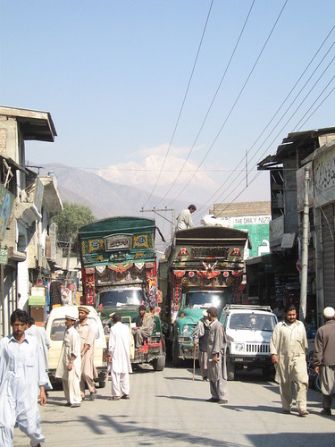 Traffic jam, Chitral town with Tirich Mir in the background