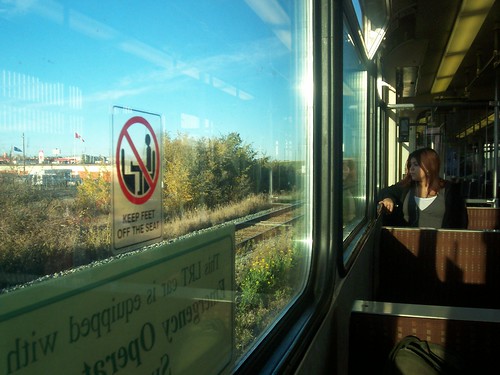 woman looking out the train window