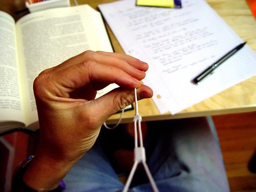 music pen work table reading book sitting ipod hand desk finger fingers bored jeans study denim homework grab headphone grasp