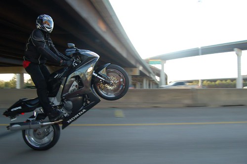 Motorcycle rider performing a stunt