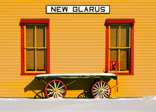 christmas railroad windows winter light red sky snow cold color colour building classic beautiful lines wheel yellow wisconsin train season wagon landscape outdoors switzerland design town flat little swiss side small fineart wideangle vision covered depot siding wi americas stockphoto glarus artistry winterlandscape stockphotography royaltyfree newglarus ruralscene greencounty rightsmanaged ruralwisconsin winterinwisconsin toddklassy