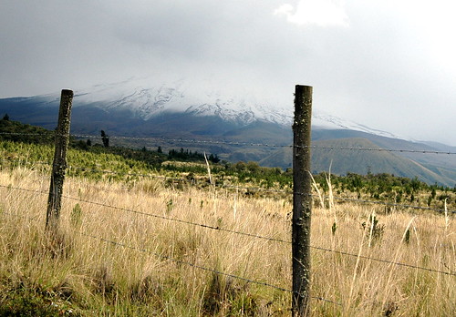 fence volcano ecuador view snowcapped fields cotopaxi