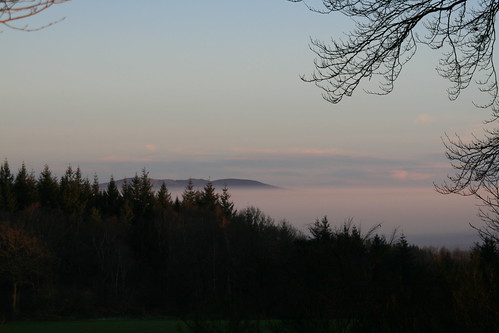 blue trees sunset sky orange sun mist nature fog set clouds natural hills phil:group=itakepix