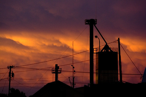 sunset cloud clouds grain elevator power lines line pole antenna silhouette midwest morris minnesota july 2006