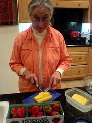 anna cutting fresh pineapple and strawberries   DSC0… 
