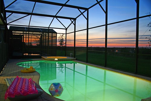 vacation sun reflection water pool set yard out outside evening back doors florida horizon disney