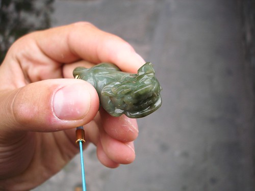 A deep green jade pendant