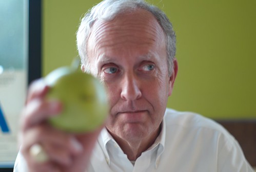 Scott holding a plastic apple