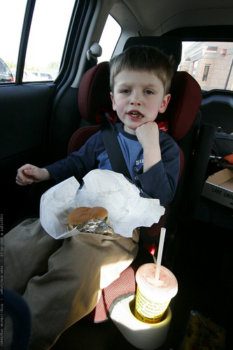photo: nick evaluating a wendy's kids meal from his car seat MG 5667 ...
