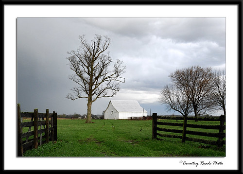 life white storm building tree green architecture clouds barn rural america fence spring nikon farm gray land weathered d200 nikkor delapidated outbuildings rightplacerighttime 18200mmf3556gvr countryroadsphoto infences