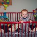 adorable toogs standing in his crib!