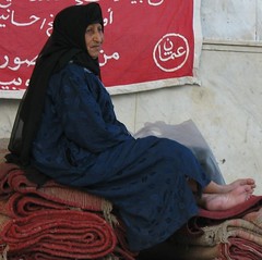 Woman from Rifai'i Sufi Order in front of Al-Huseyn Mosque