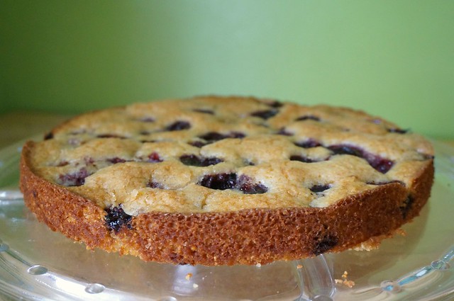 Light and airy cherry cake on a cake plate — it almost looks like a giant cookie