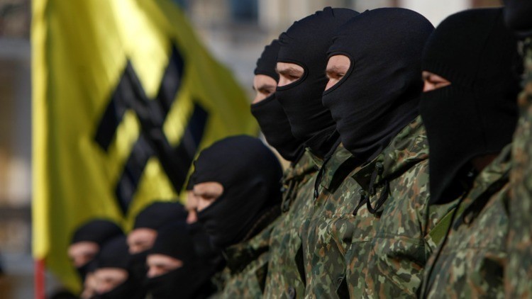 New volunteers for the Ukrainian interior ministry's "Azov" battalion take their oath of allegiance to their country during a ceremony in Kiev October 19, 2014. According to the battalion's commander, the volunteers will be headed to the frontlines in Eas