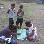 Douglas explaining poster to young kids